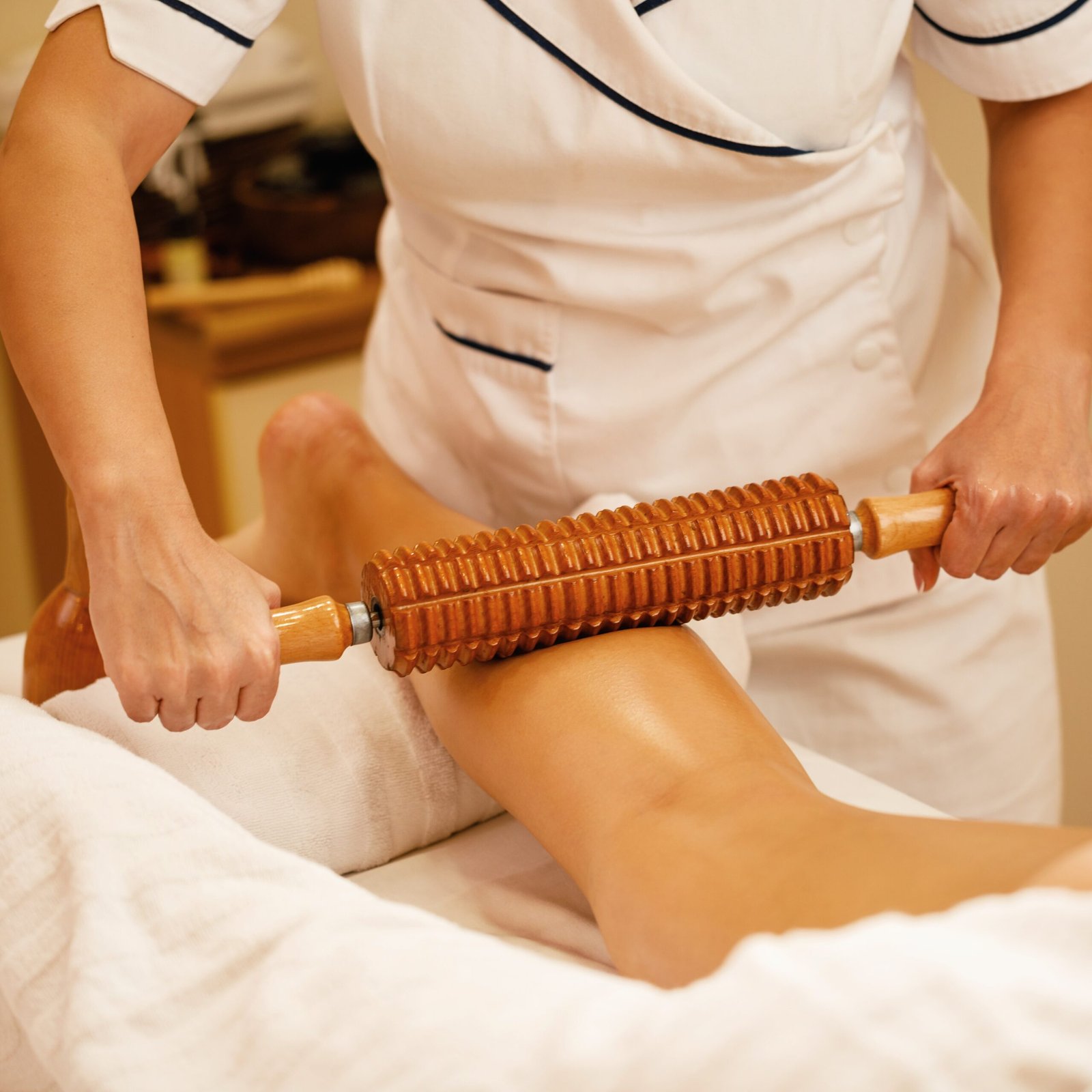 Unrecognizable woman during maderotherapy at the spa.